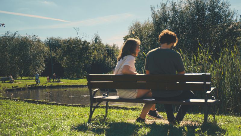 Photo “Couple sitting on a bench” by Joanna M Foto