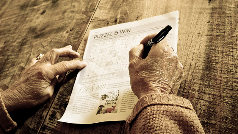 Photo “Person Writing on Puzzle & Win Paper” by Matthias Zomer