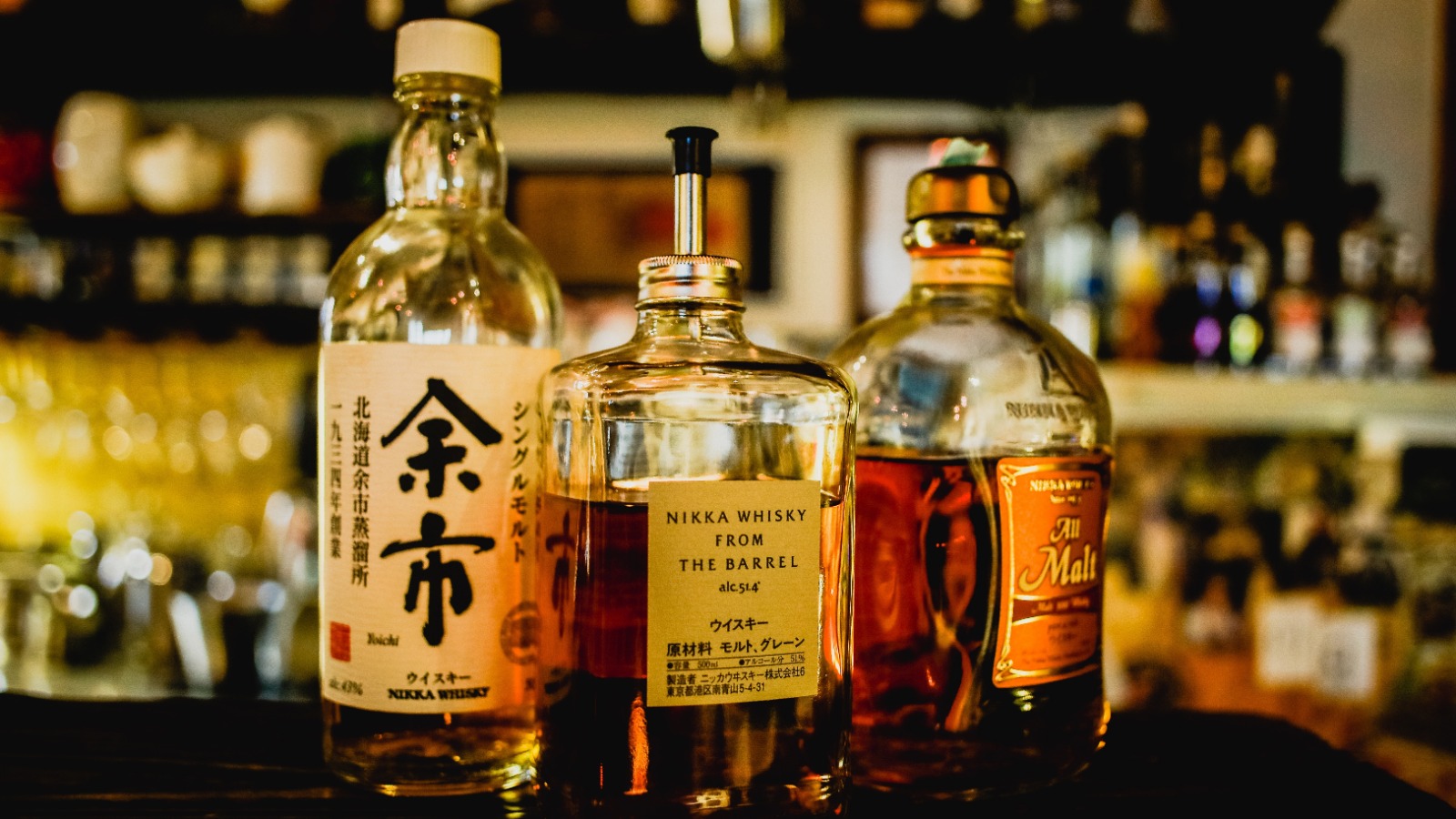 Photo “Three Assorted Liquor Bottles on Table” by Pixabay