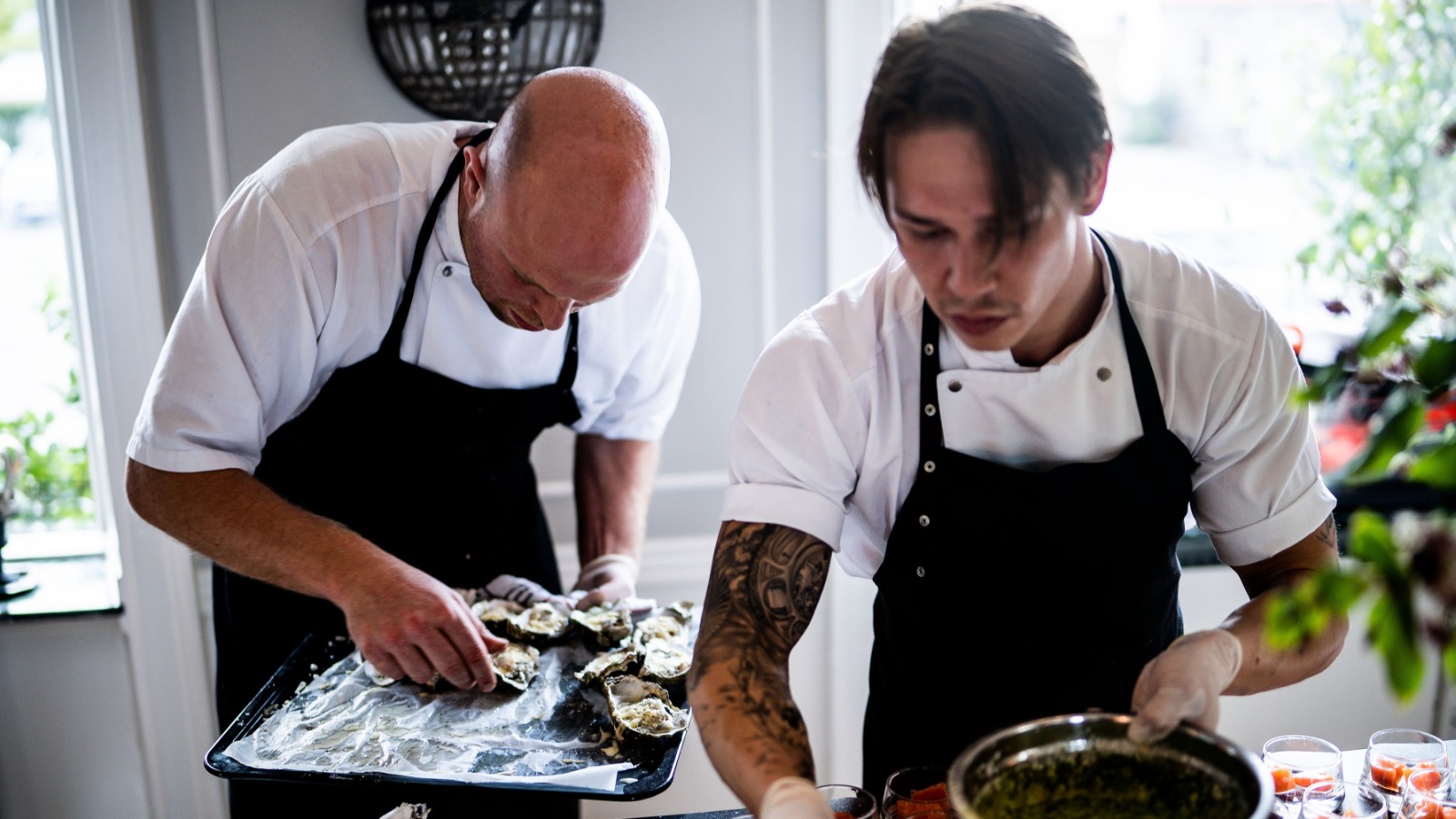 Photo “Two Men Preparing Food” by Rene Asmussen